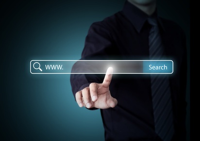 Hand pressing Search button, Internet technology concept